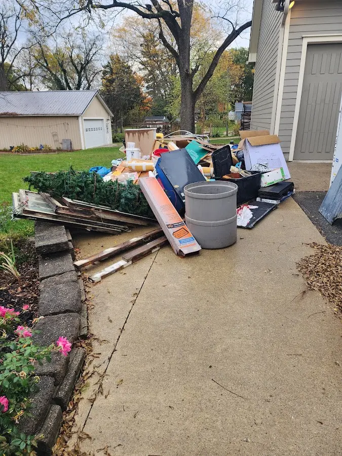 Dumpster being loaded with debris for 12 Yard Dumpster Rental in O'Hara